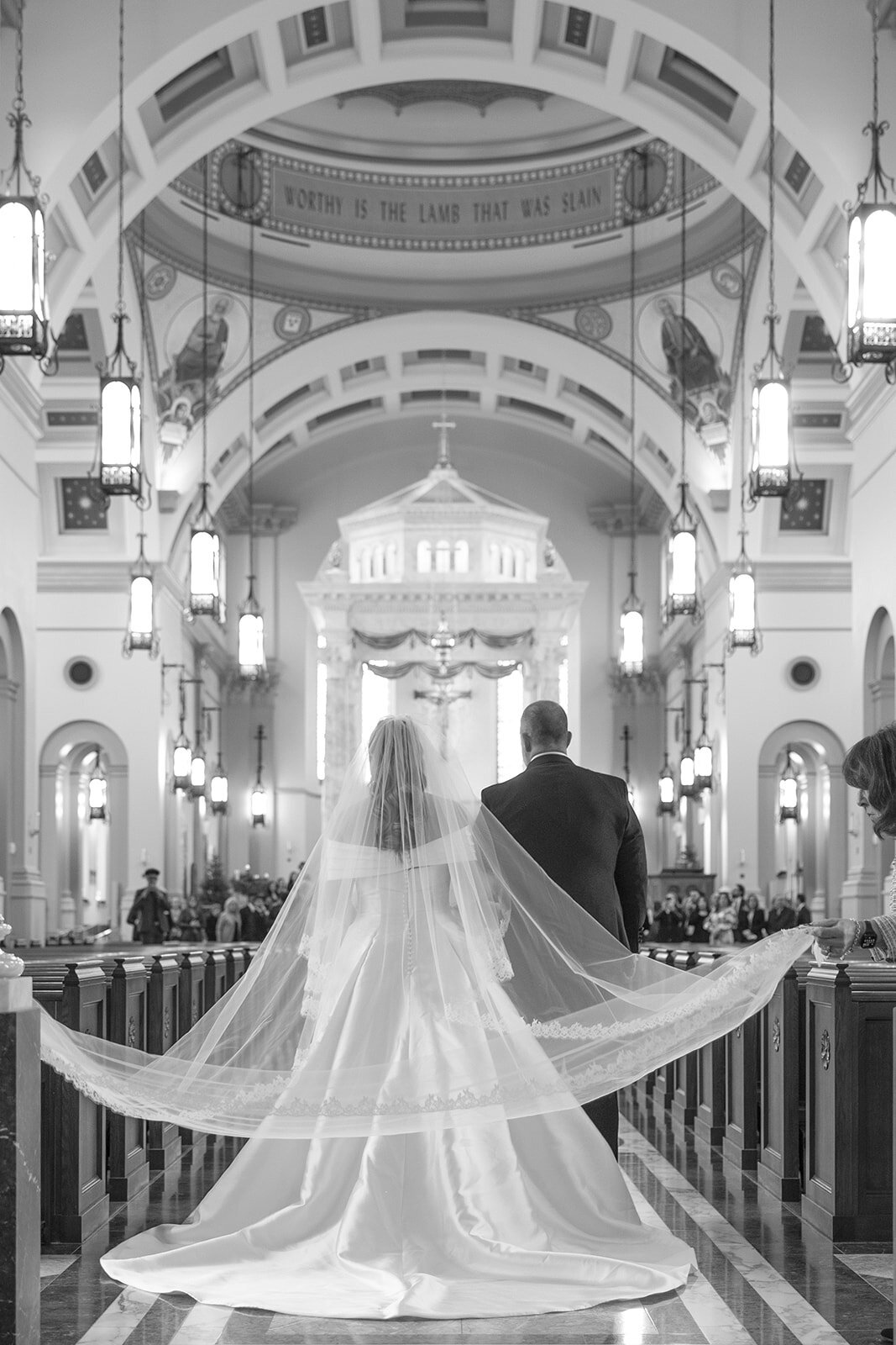 Bride walking down the aisle at Cathedral of the Most Sacred Heart of Jesus in Tennessee