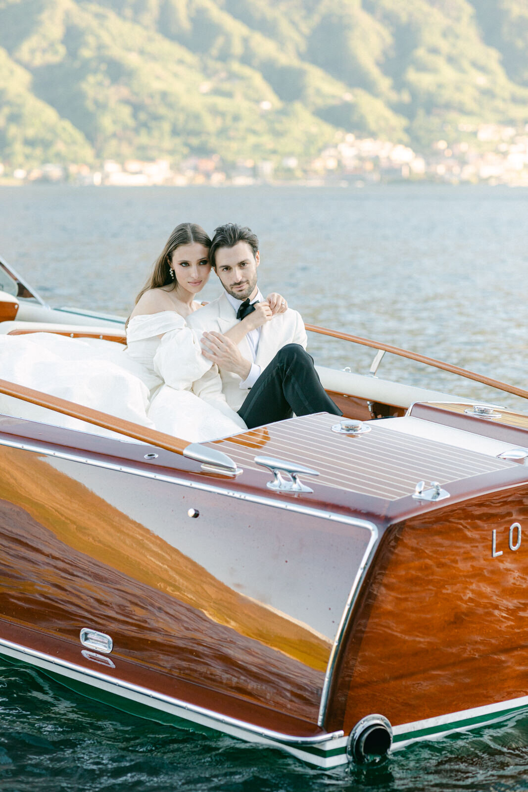 wedding couple boat ride on a wooden Cadenazzi in Lake Como