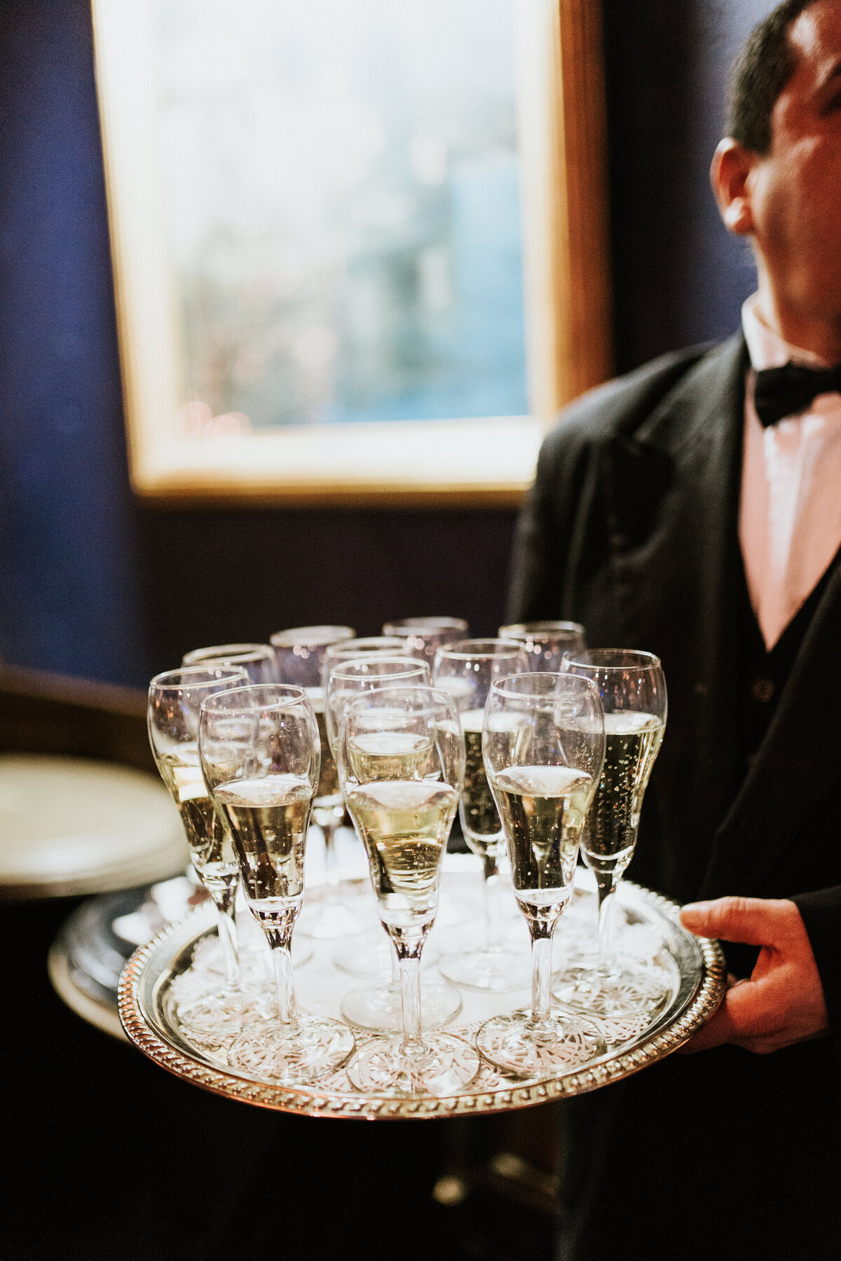 Champagne on tray at New Year's Eve wedding