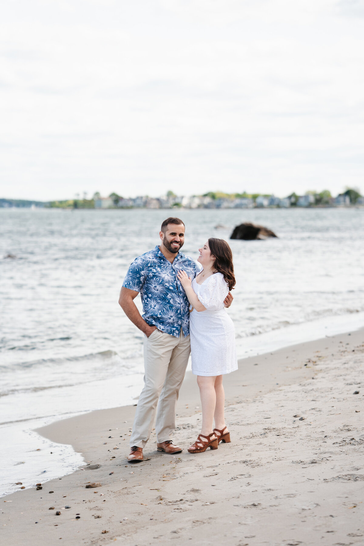 Couple walking through the rose garden at Lynch Park during their Beverly engagement session with Danielle Littles Photography