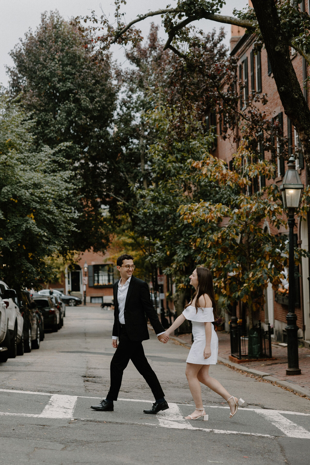 couple walking across street