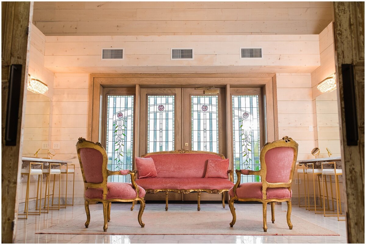 Bridal suite with vintage couches and stained glass windows at Walker Farms