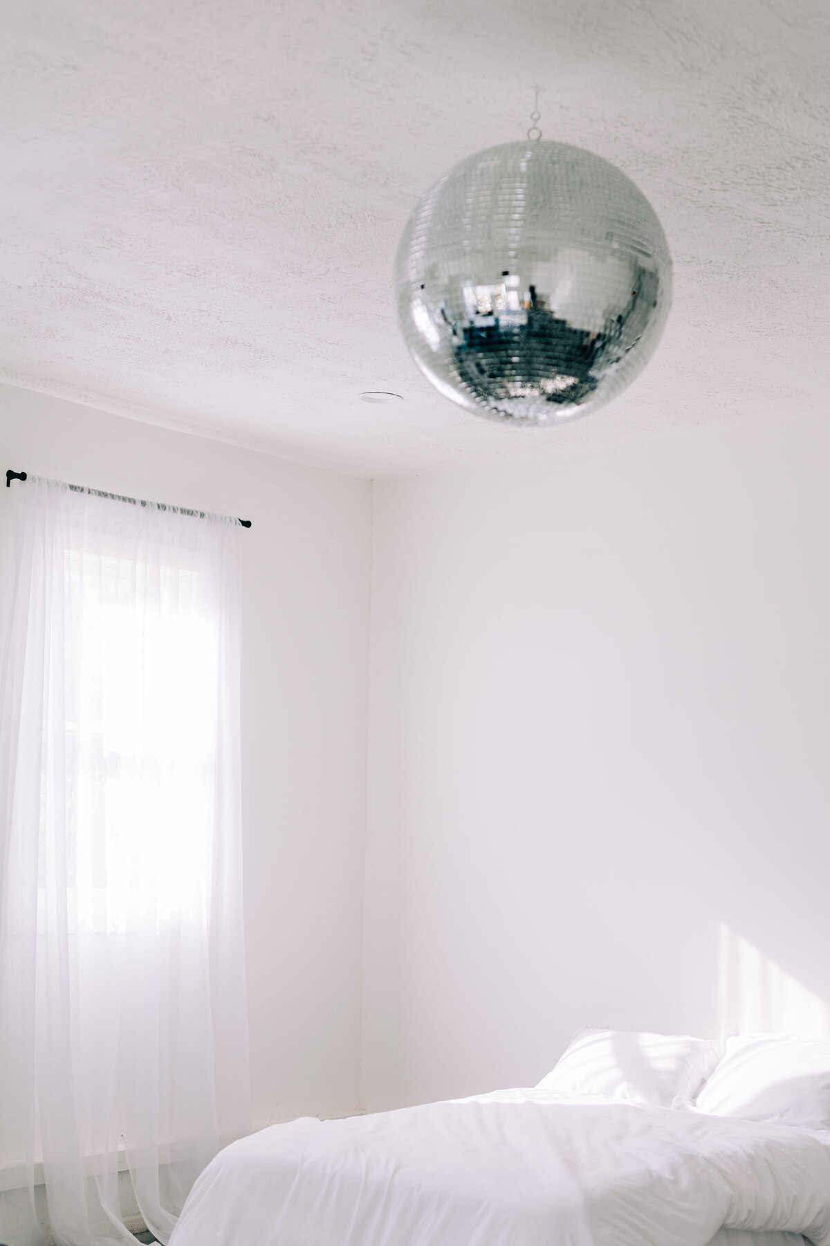 Winx Photo studio featuring disco ball and white bed