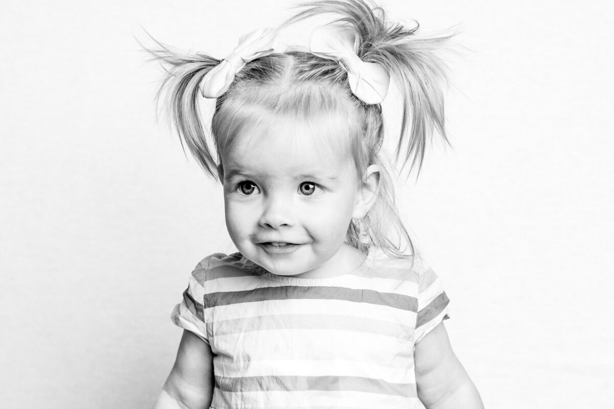 girl with pigtails smiling-2