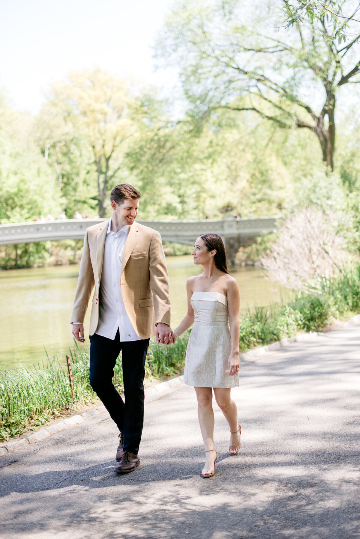 engagement photos by the bow bridge in central park