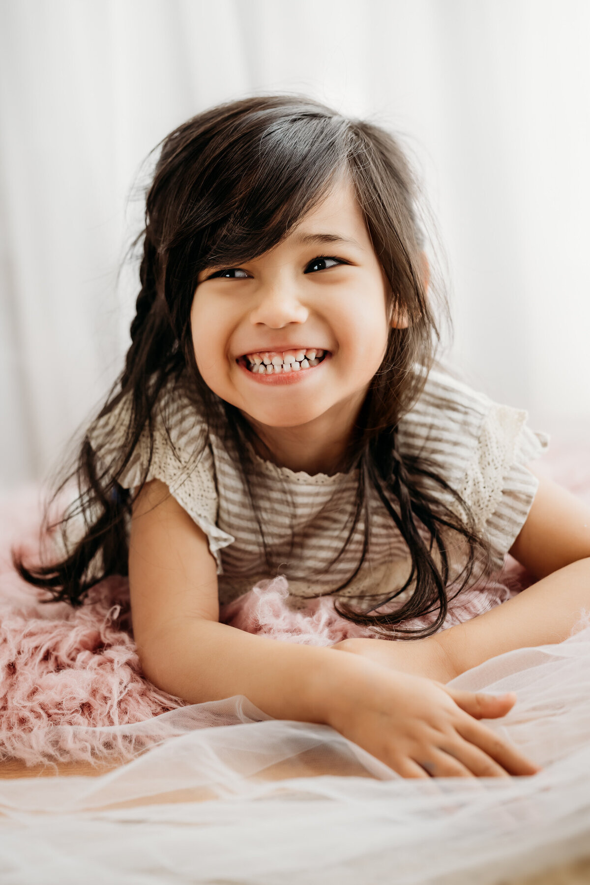 toddler laughing at a personality portrait session