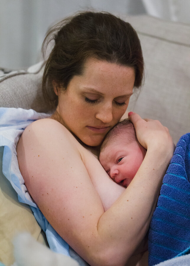 A mother cherishes the first moments with her baby. Photo by Diane Owen.