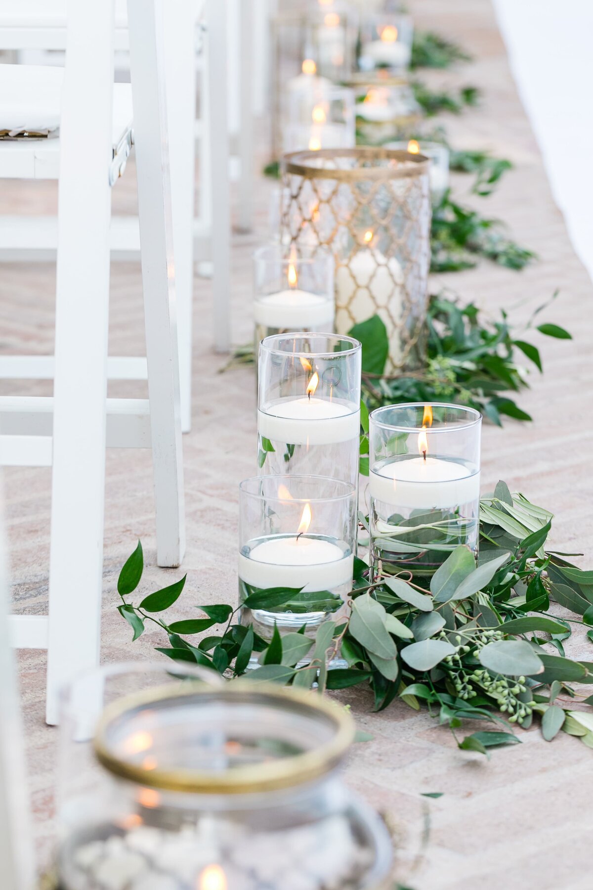 ceremony-aisle-with-candles-and-greenery