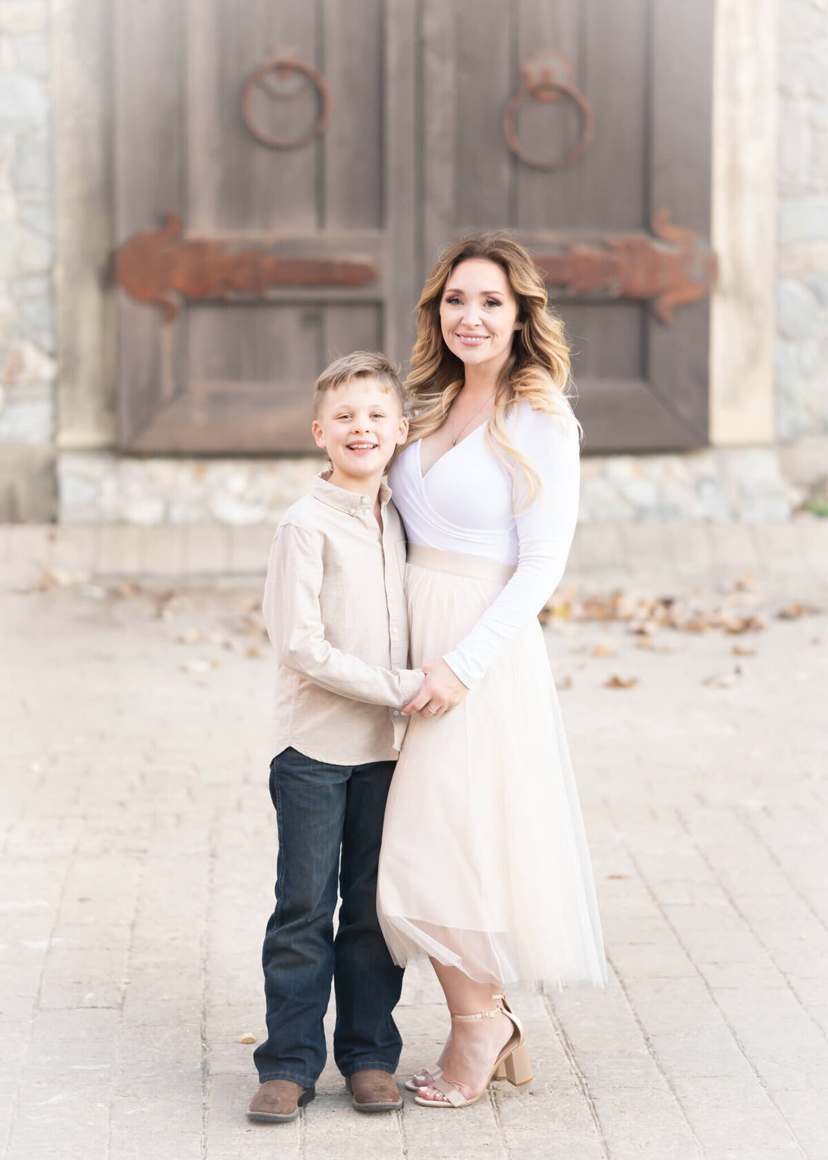 mother and son hugging in beautiful portrait in Adriatica village