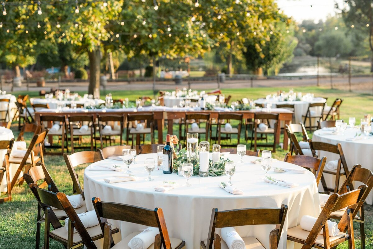 DA Ranch Southwestern Weddings west-lawn-reception-tables-facing-pond-scaled