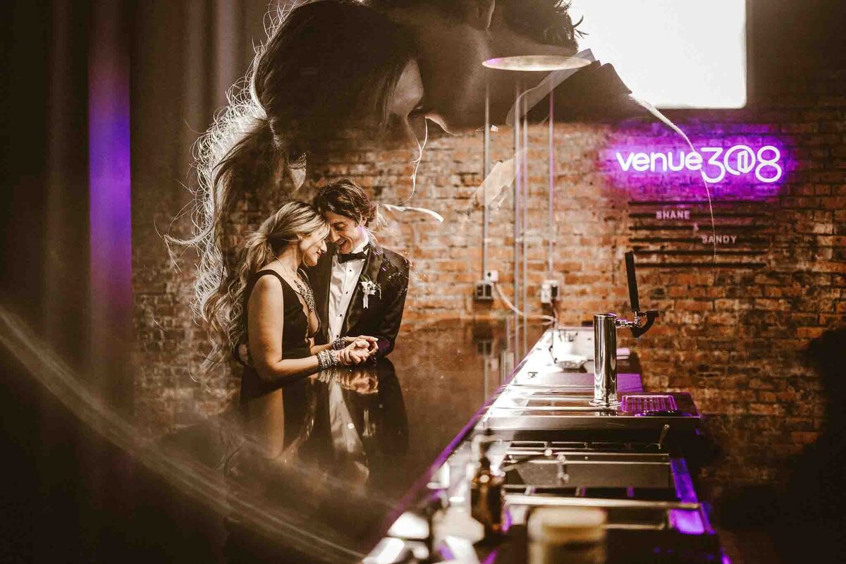 Trendy double exposure of couple playing pool at Venue 308, a historical warehouse wedding venue in Calgary, featured on the Brontë Bride Vendor Guide.