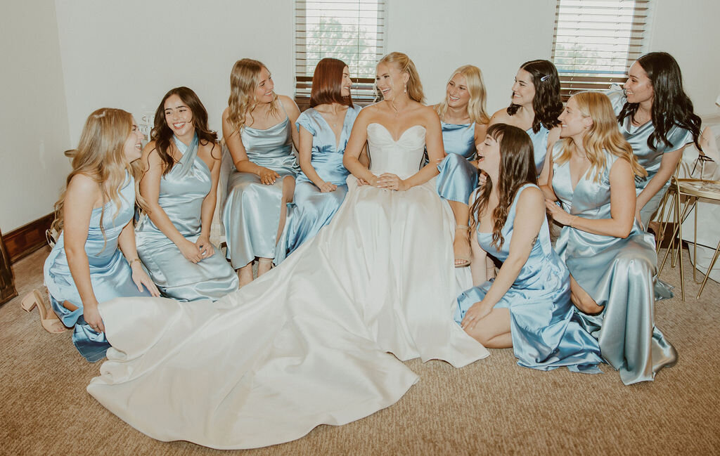 Bride with her bridesmaids in the getting-ready suite
