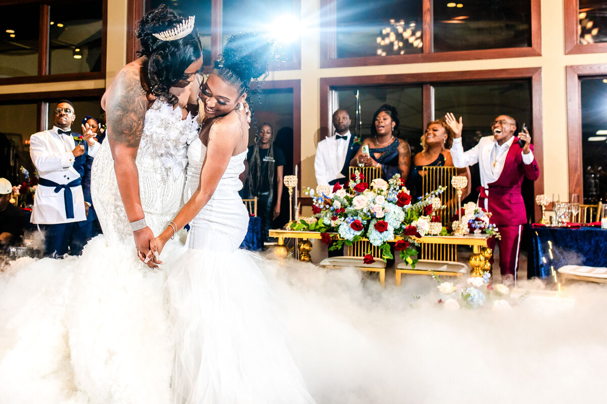 A magical moment as two Black brides share their first dance on the clouds during their same-sex wedding at Savannah Rapids. A celebration of love, unity, and elegance. Designed by COuture Events andThe Diva Wedding Planner