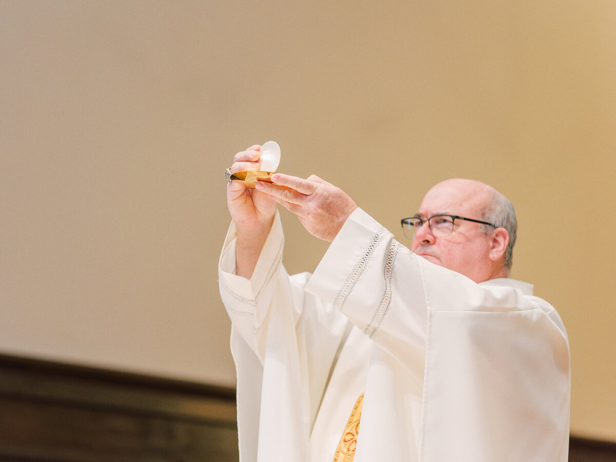 Elevation of the Eucharist during Catholic wedding
