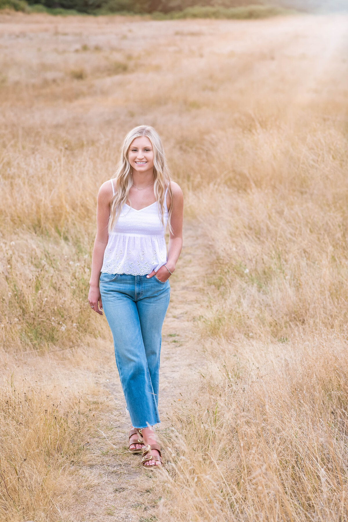 girl walking in tall grass Discovery Park Seattle