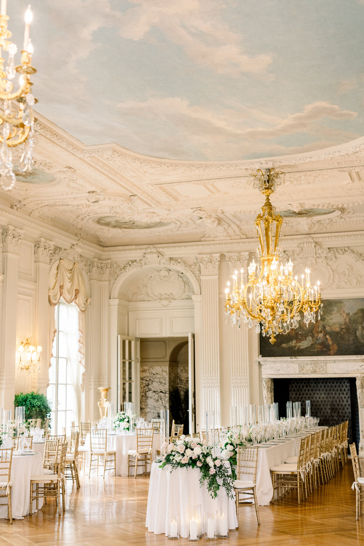 gilded age chandelier in grand ballroom of rosecliff mansion in newport rhode ialand, establishing shot of recpetion space before guests arrive