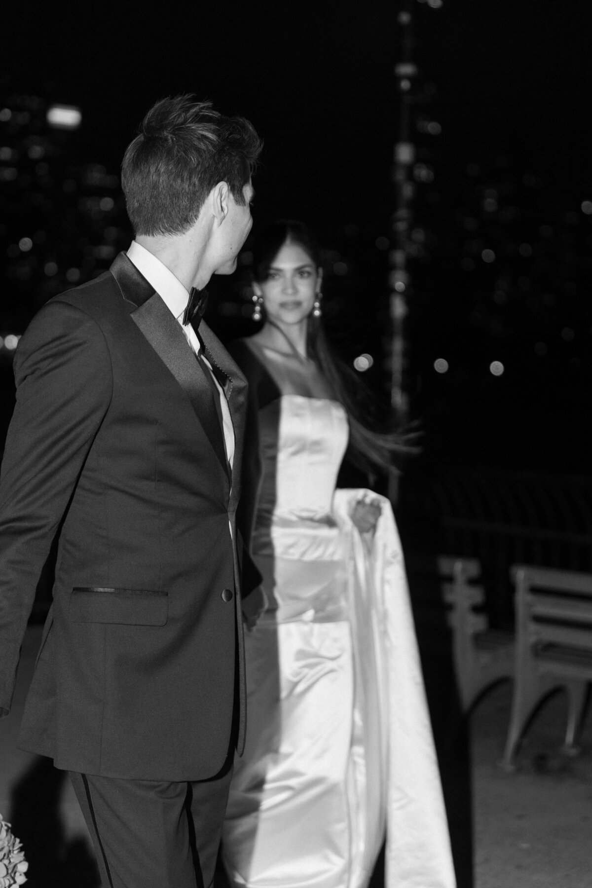 Black-and-white candid portrait of a couple during an editorial wedding session.