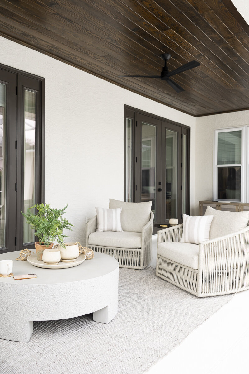 dewine design orlando interior designer belle isle patio with round table and dark wood ceiling
