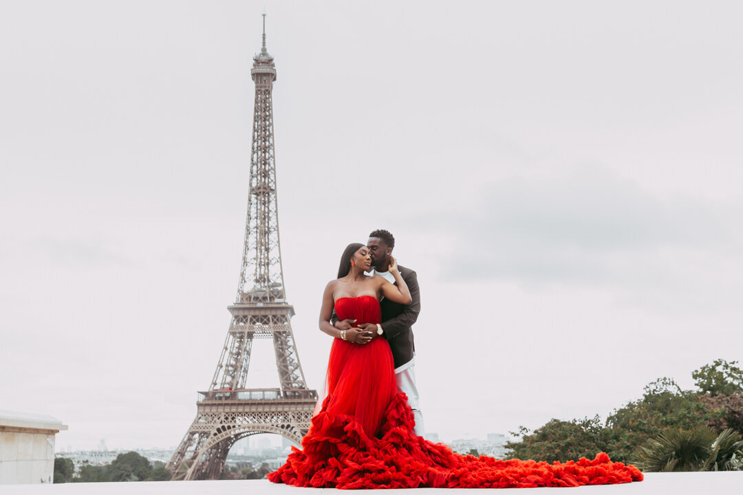 African American couple Paris photoshoot, red princess dress, Eiffel Tower backdrop, luxury photography