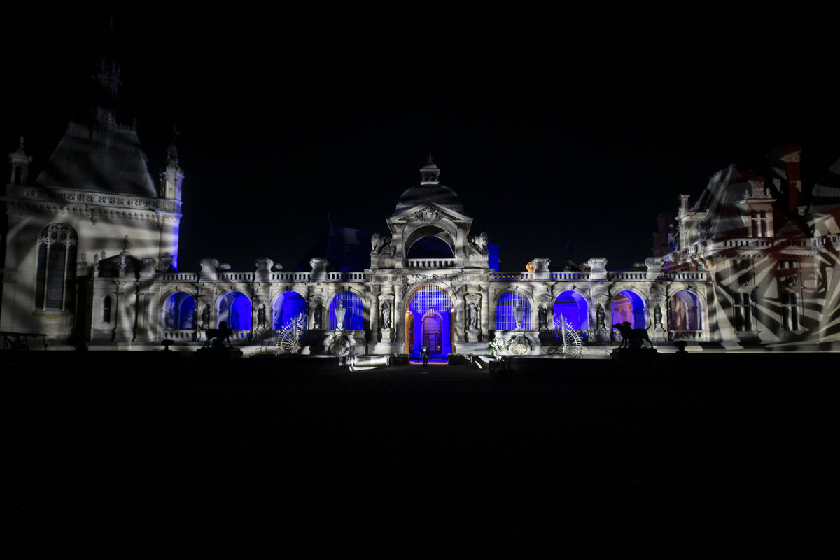 Paris Destination Wedding at Chateau de Chantilly by Alejandra Poupel Events horizontal nights lights chateau 2