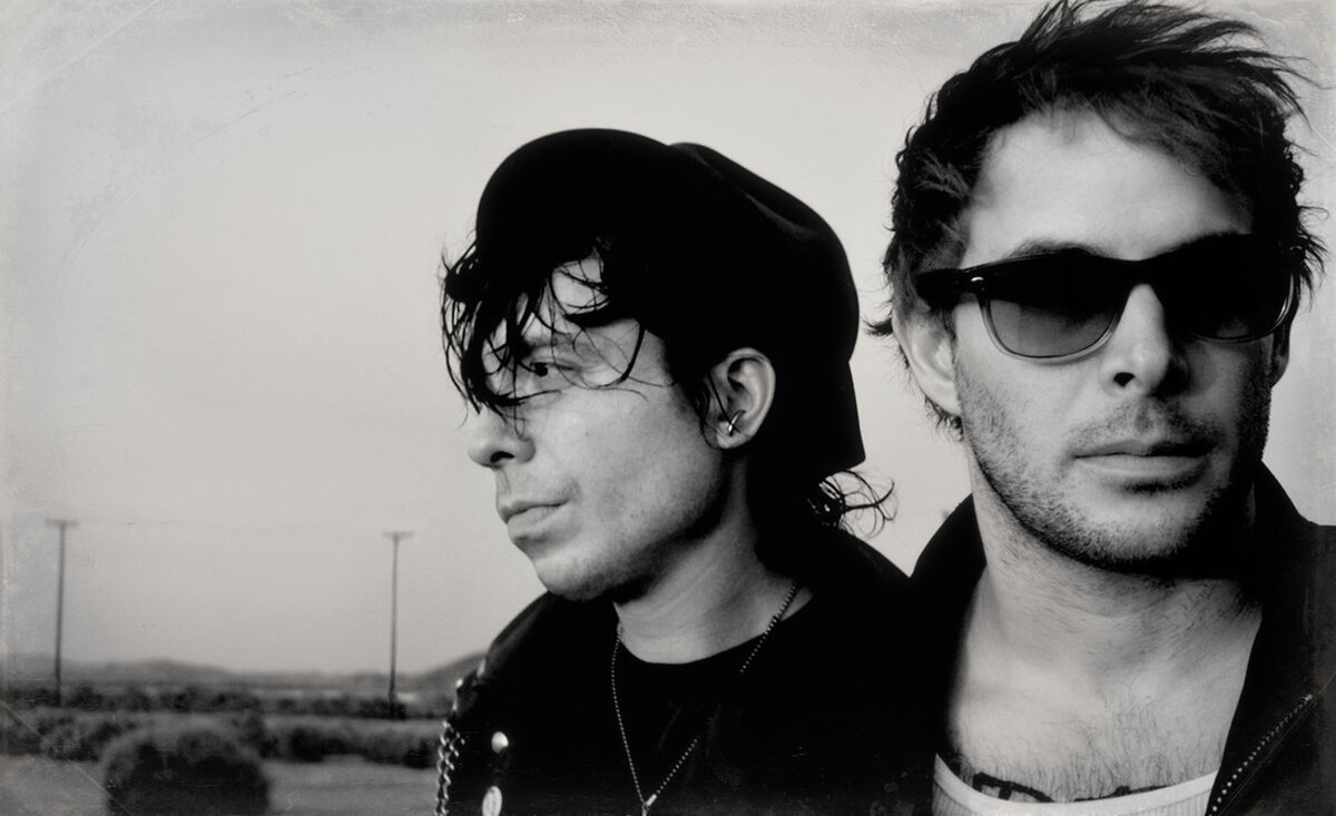 Musical duo portrait Dead Day Revolution  black and white close up desert backdrop