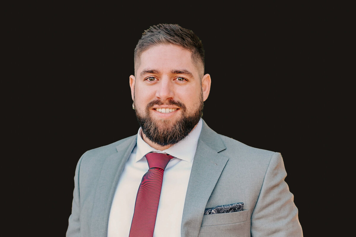 professional headshot photo in Branson of man in grey suit