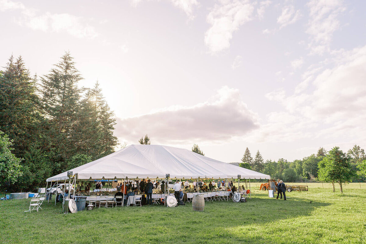 An outdoor wedding reception tent at a Veneta farm wedding.