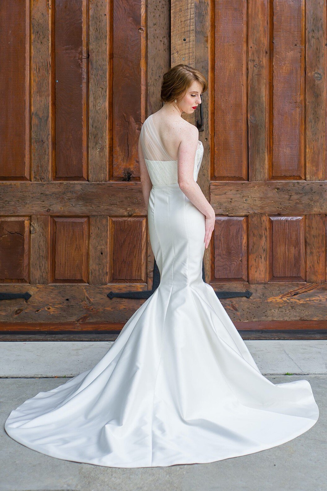 The flare of the mikado mermaid skirt is accentuated by the train for a dramatic but timeless bridal look.