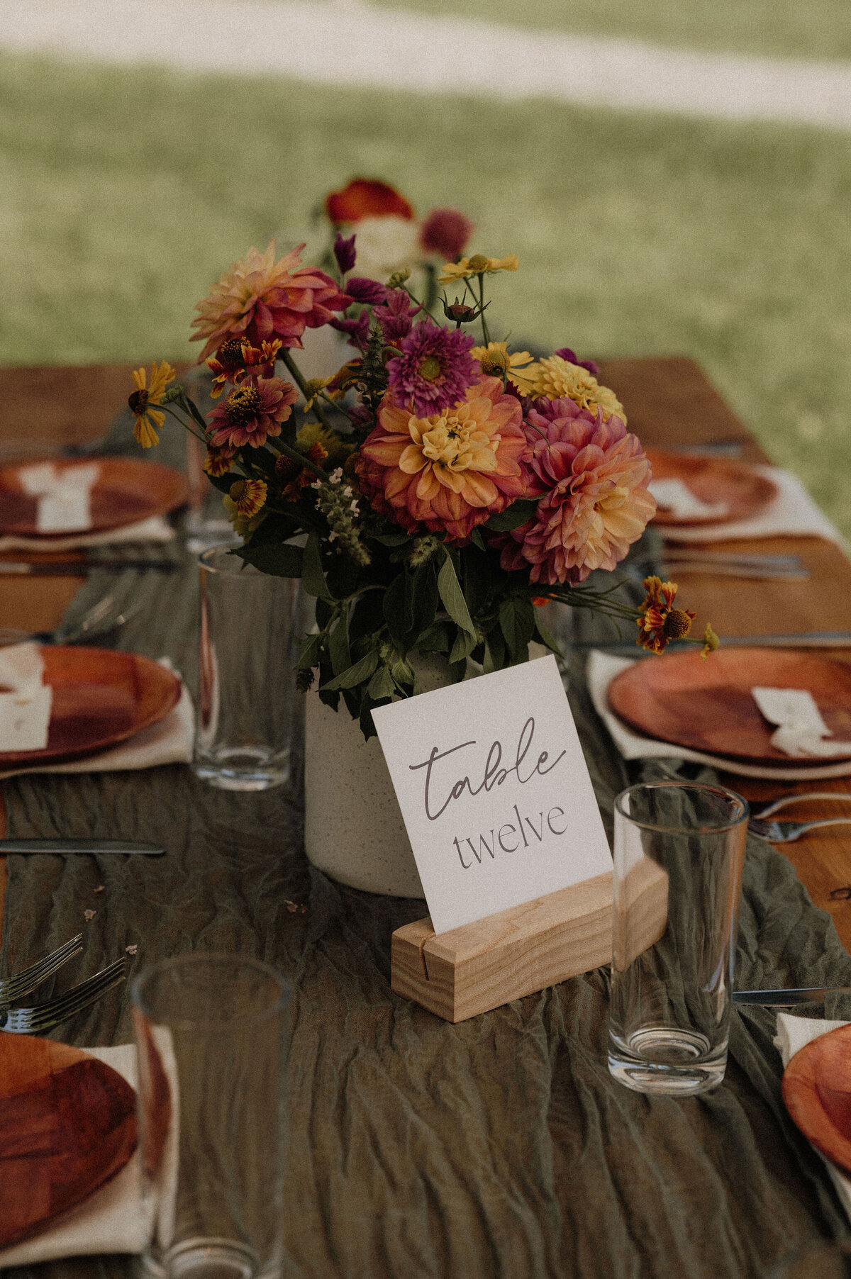 Tablescape with table number and plating for Maine reception