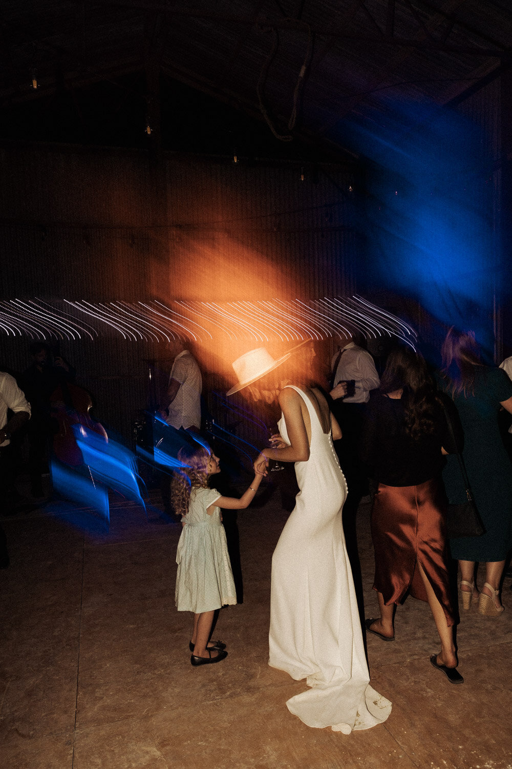 A bride in her cowboy hat having a dance from her wedding, taken by Eilish Burt