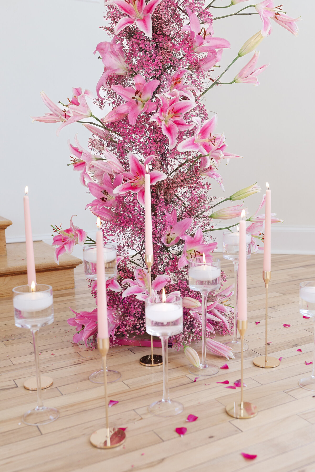 Pink lilies arch floating candles  and pink candle sticks