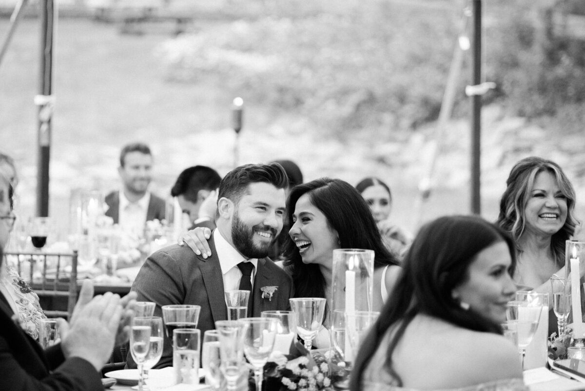 A couple leans in to one another