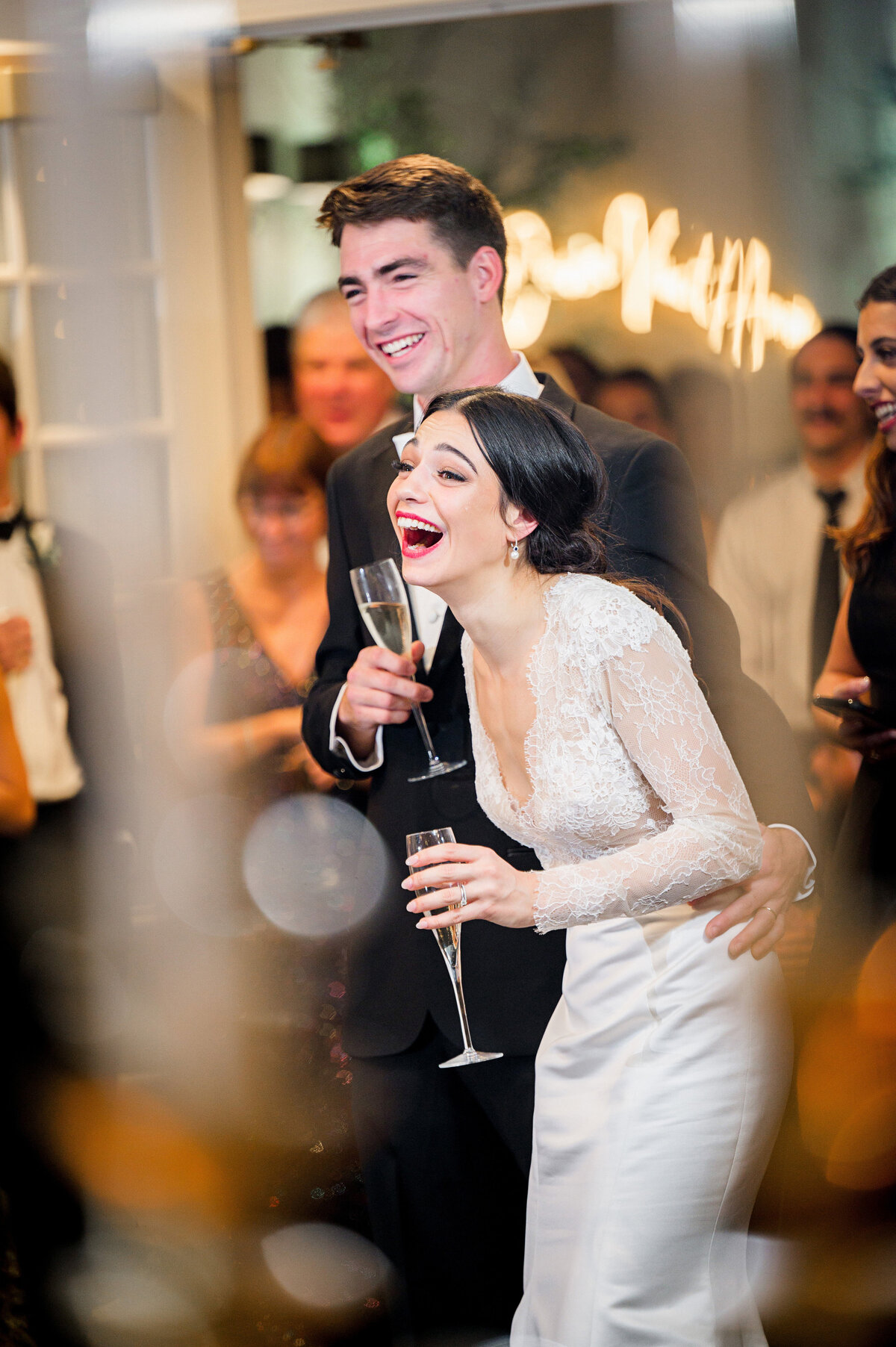 bride laughing during toasts