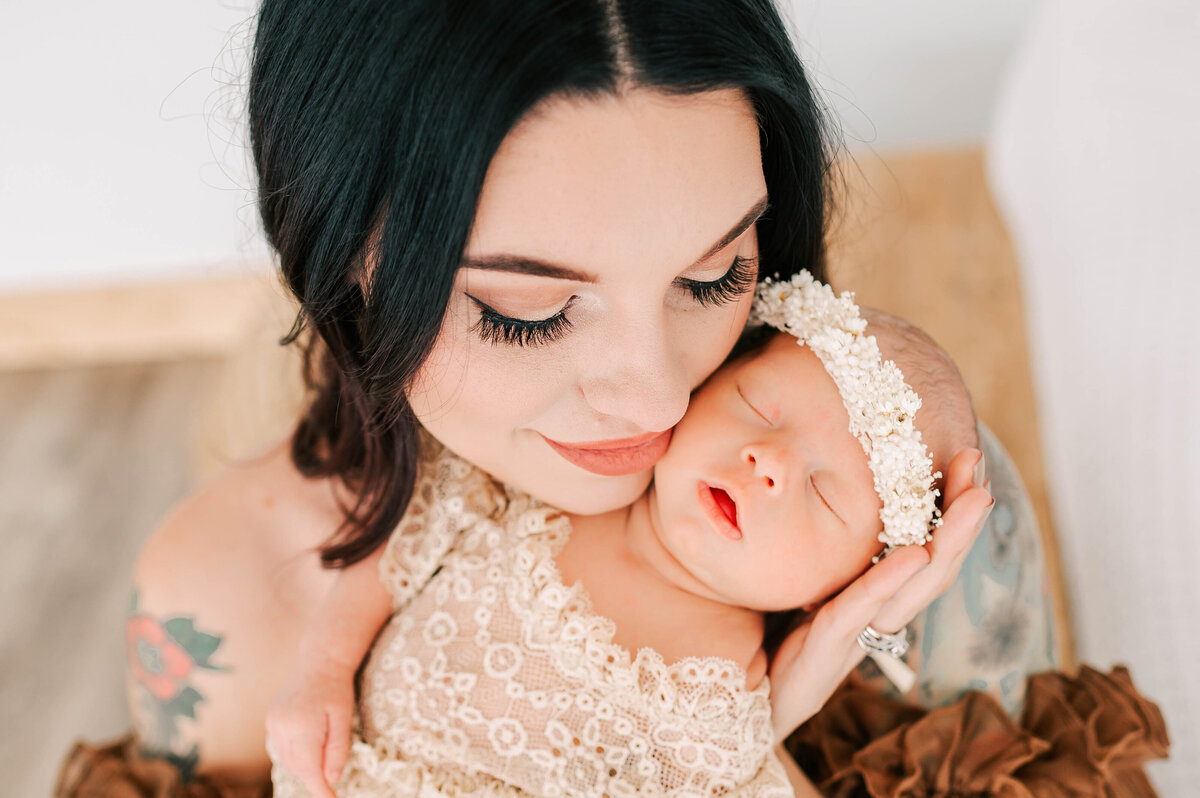 close up of newborn baby girl and mom faces during Springfield MO newborn photography session