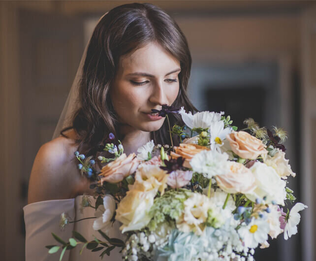 brode holding bouquet