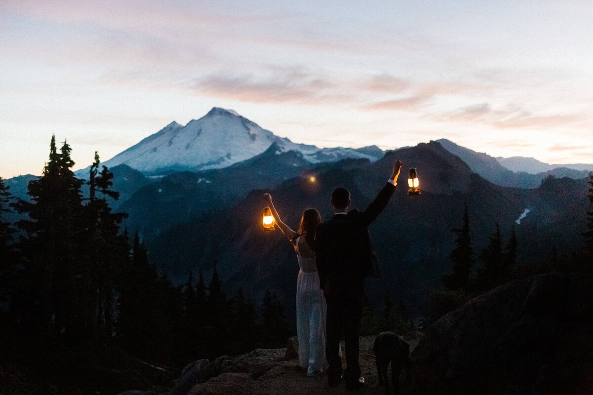 Sunset portraits with lanterns at the end of this couple's North Cascade Elopement