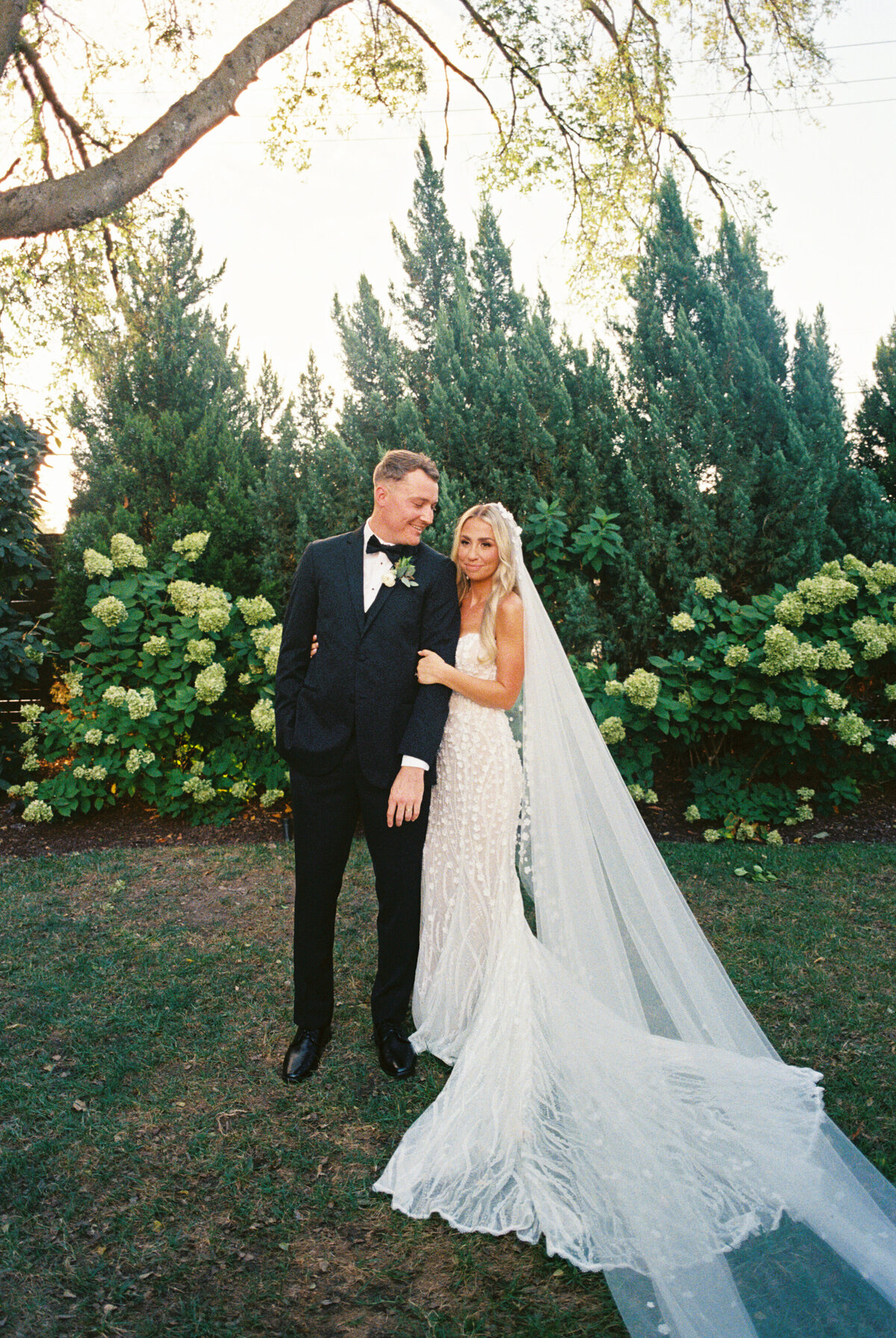Film photo of a Tampa photographer shooting a romantic wedding portrait.