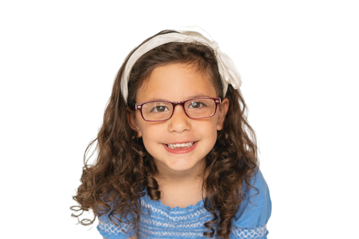 Boston area school photo of little girl with white headband