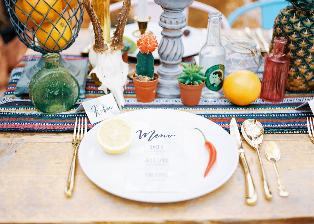 A mexican themed dinner for a birthday party or event with a cactus and tequila.