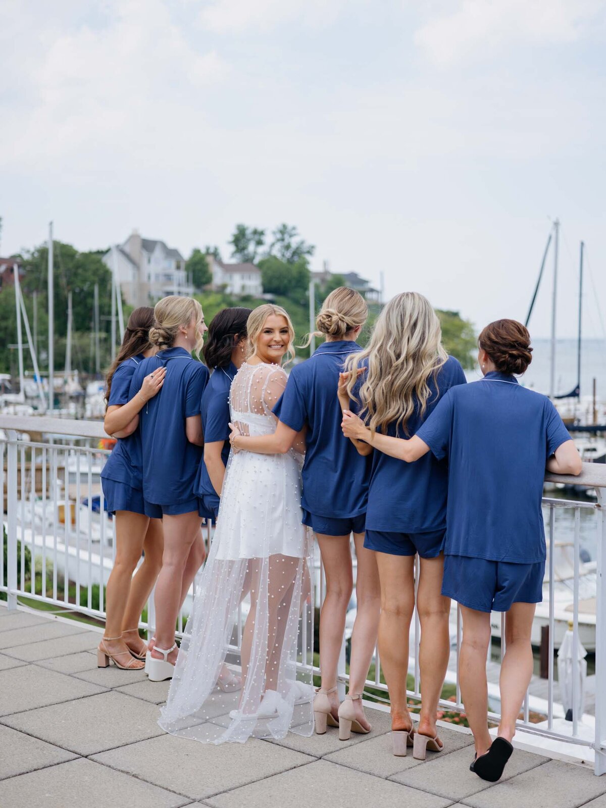 Bride with bridesmaids in matching blue pj's at Cleveland Yachting Club
