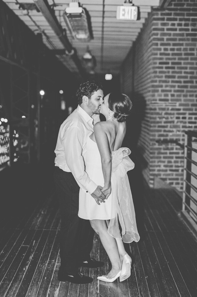 Bride and Groom embracing and kissing