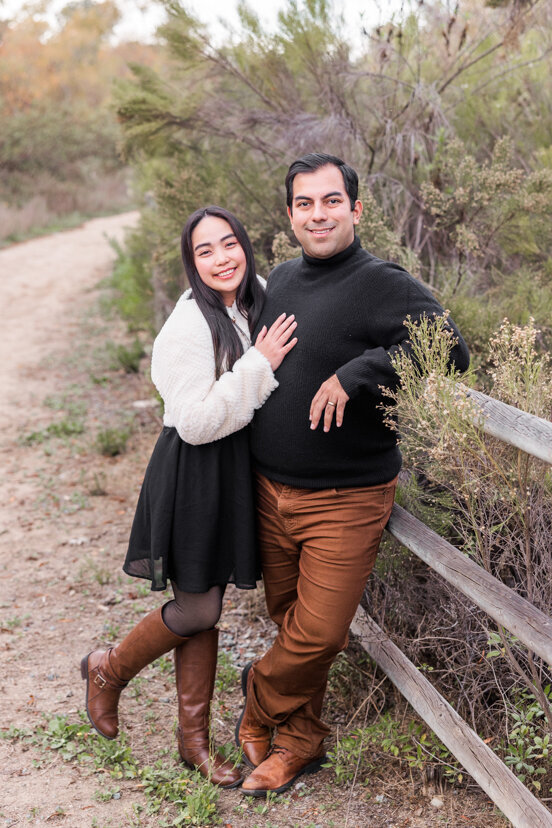 couple-leaning-on-fence-Bonita-San-Diego