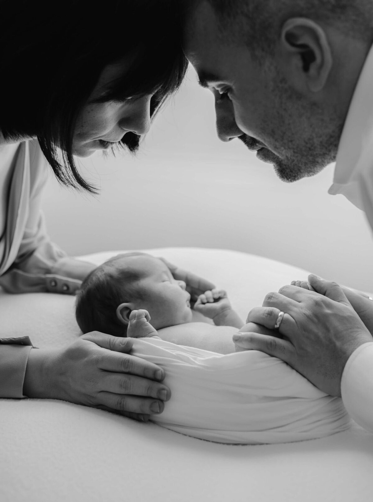 Baby wrapped in neutral swaddle, captured by San Francisco Bay Area newborn photographer.