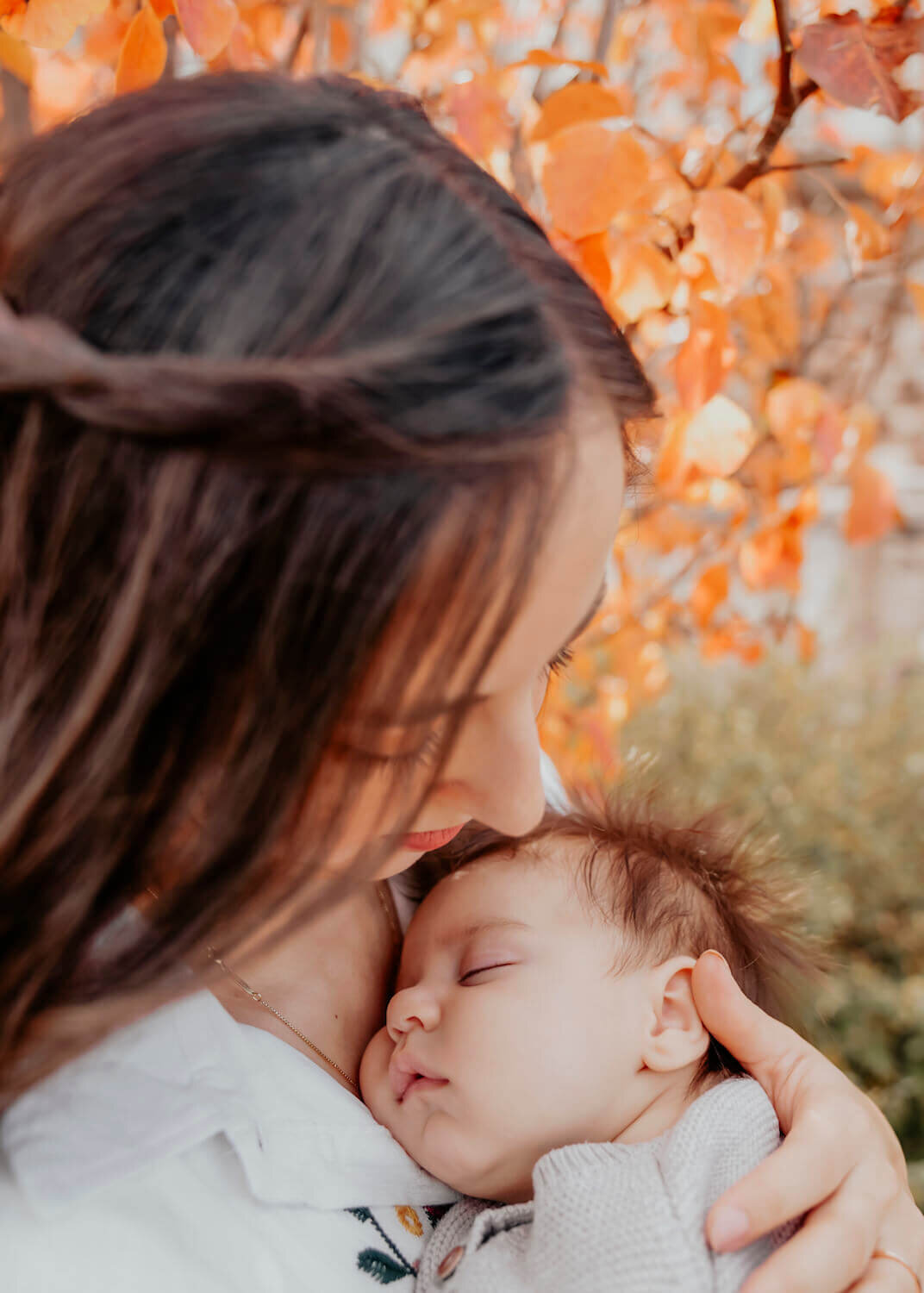 denver family photography - woman holding baby in arms