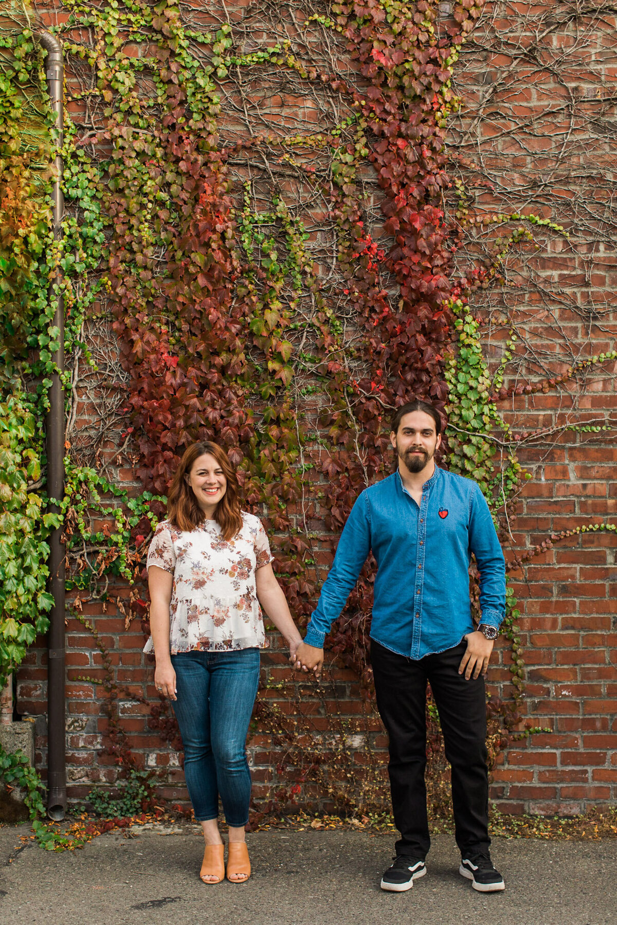 Urban engagement photos in Ballard Seattle WA Colorful fall photo with ivy growing up brick wall by Joanna Monger Photography