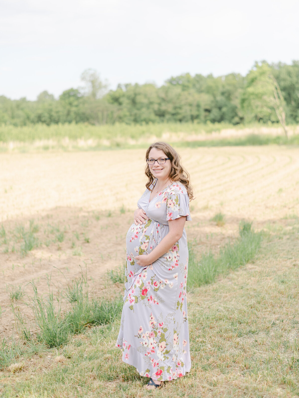 Mom holding pregnant belly during Richmond VA maternity session.