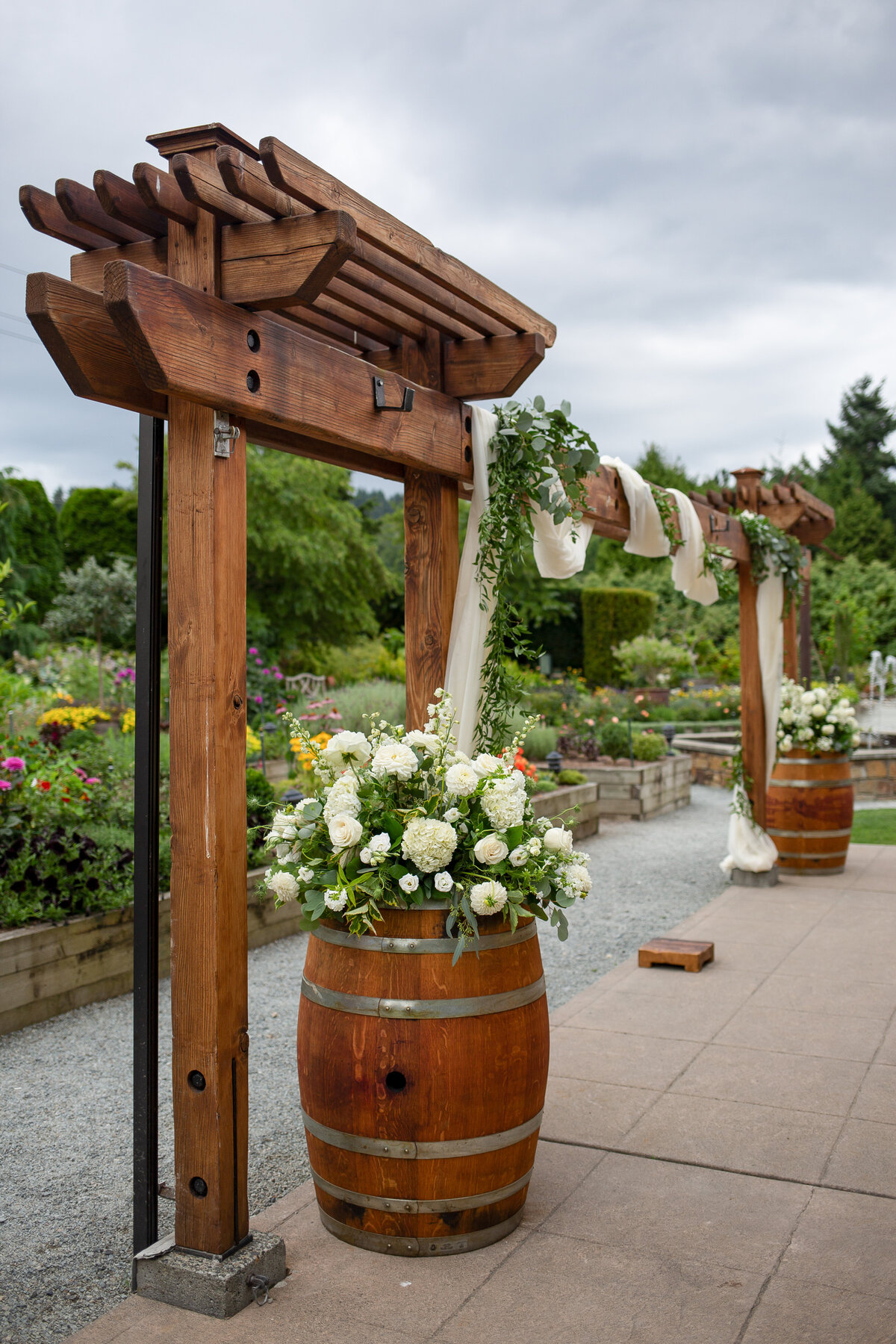 wedding ceremony patio and arch at willows lodge garden