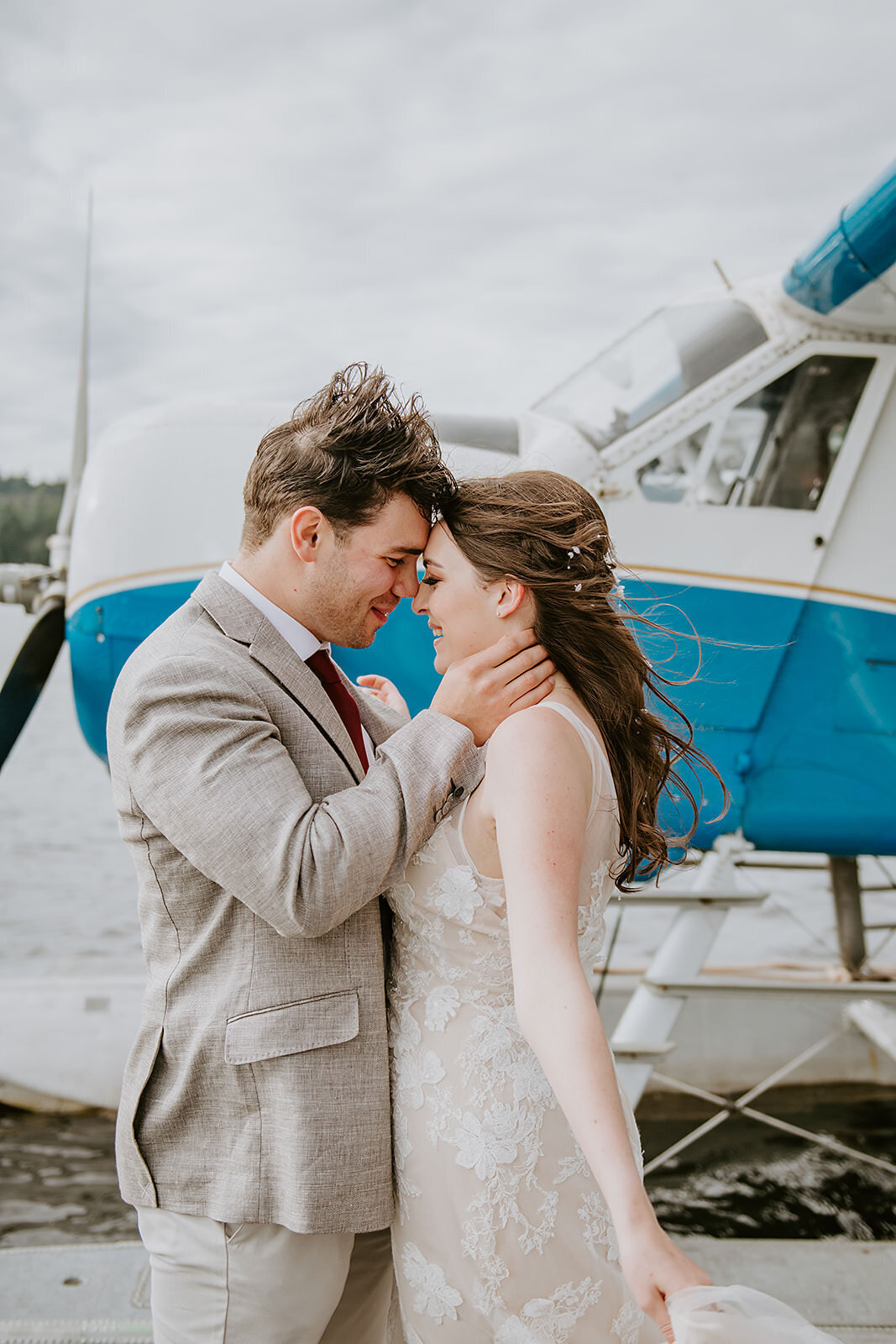 Couple having their first look on the dock awaiting to depart for their Sunshine Coast B.C waterfall elopement