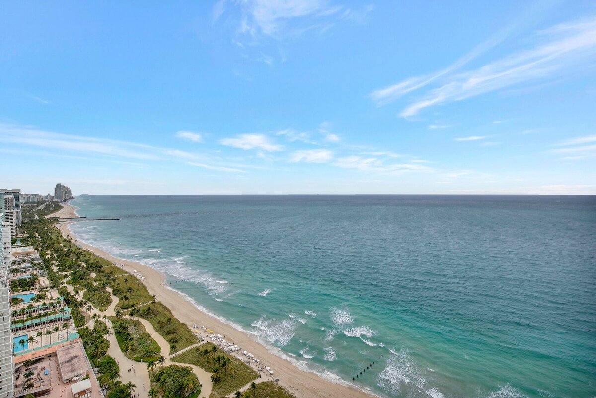 Expansive oceanfront view looking south along the Bal Harbour coastline from the wraparound balcony of PH-888 at St. Regis.