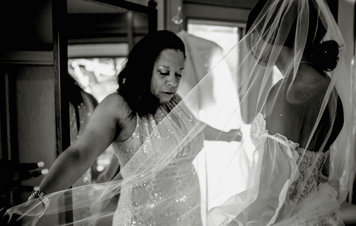 a mother of the bride perfects the veil